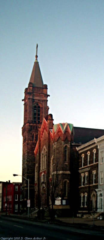 photo:  old city church lit by setting sun